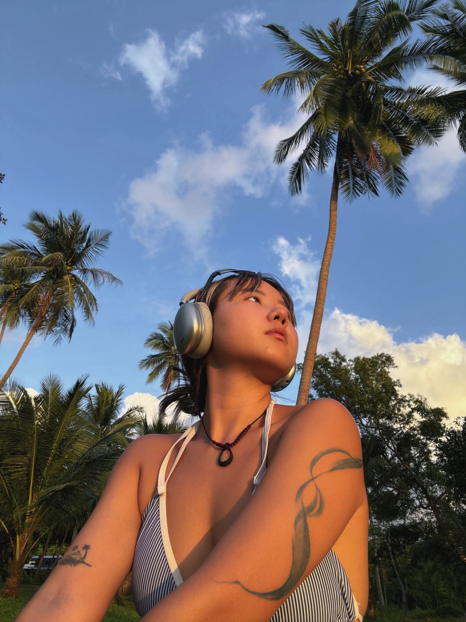 Coconut trees, headphones, ocean afternoon