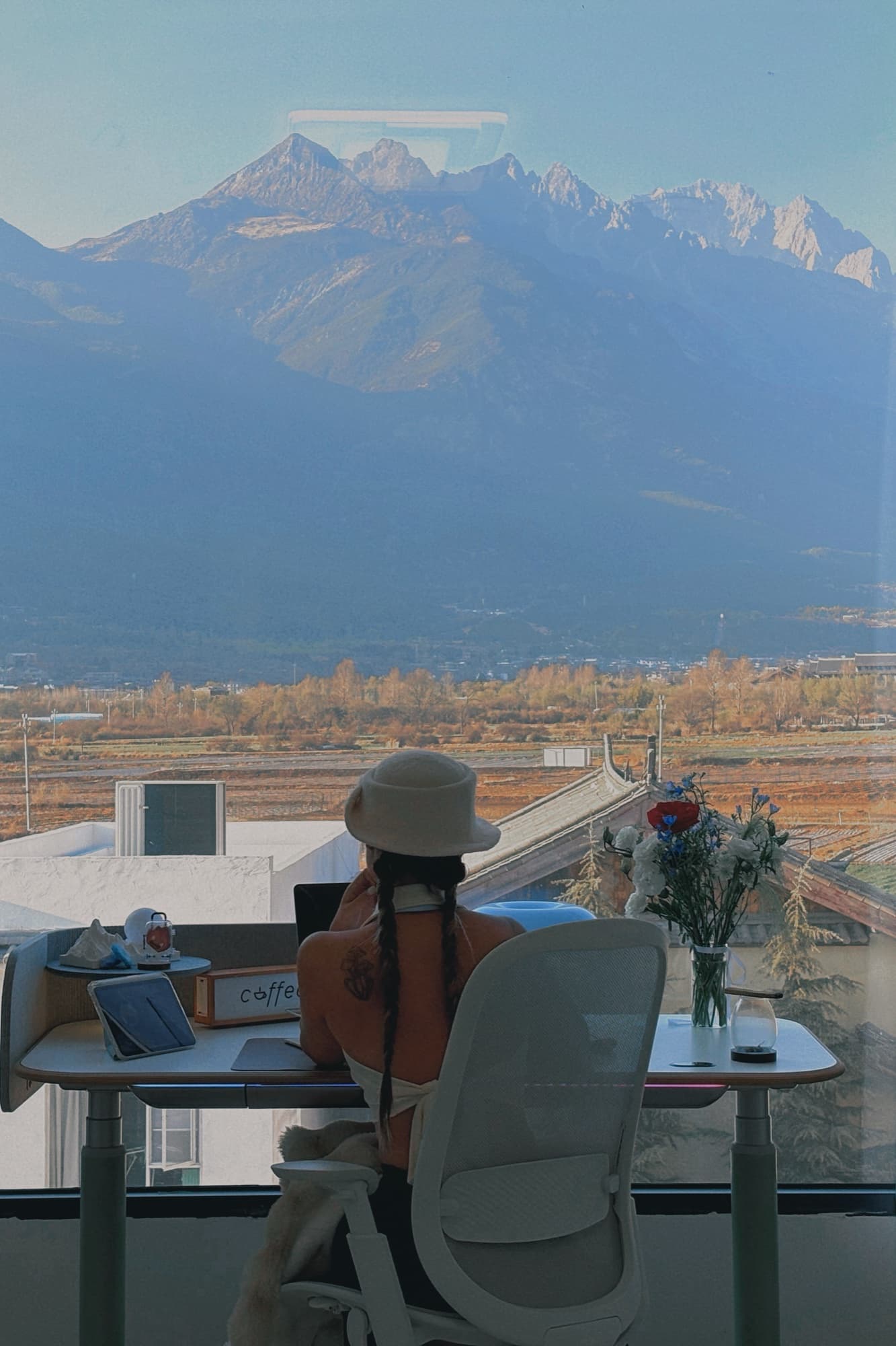 Zoe working from a mountain-side in Lijiang
